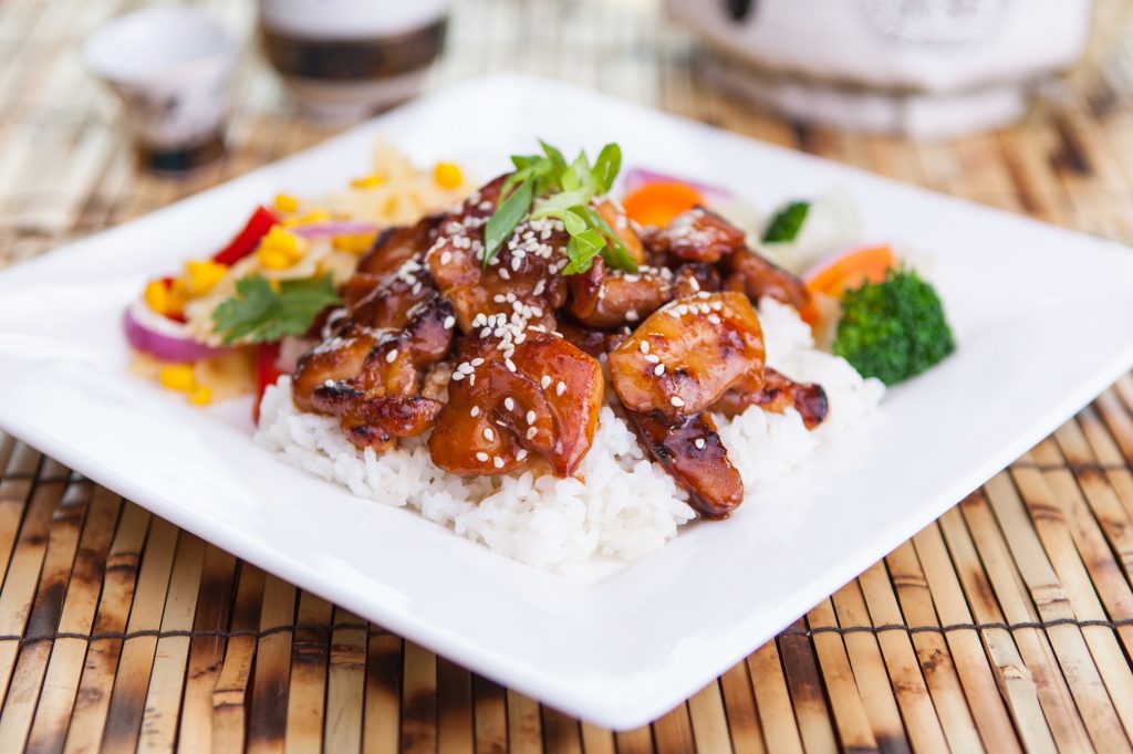 hibachi chicken nicely served with rice and veggies
